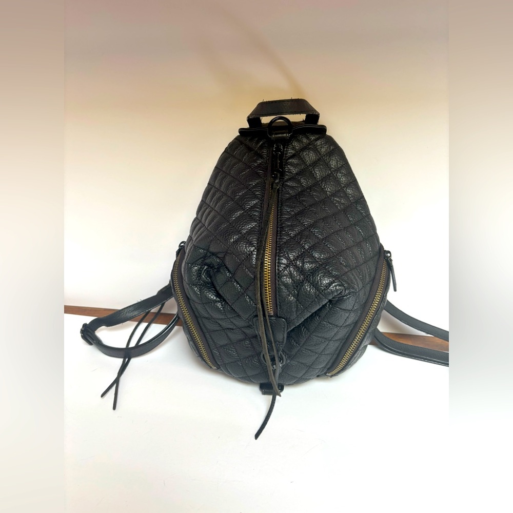 Black leather quilted backpack Used in good condition at a great price.